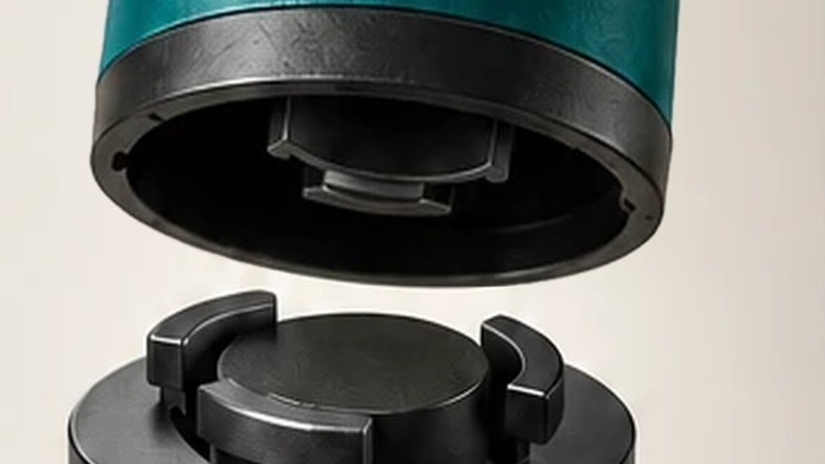 The teal Slice koozie lifted off its black twist-lock base